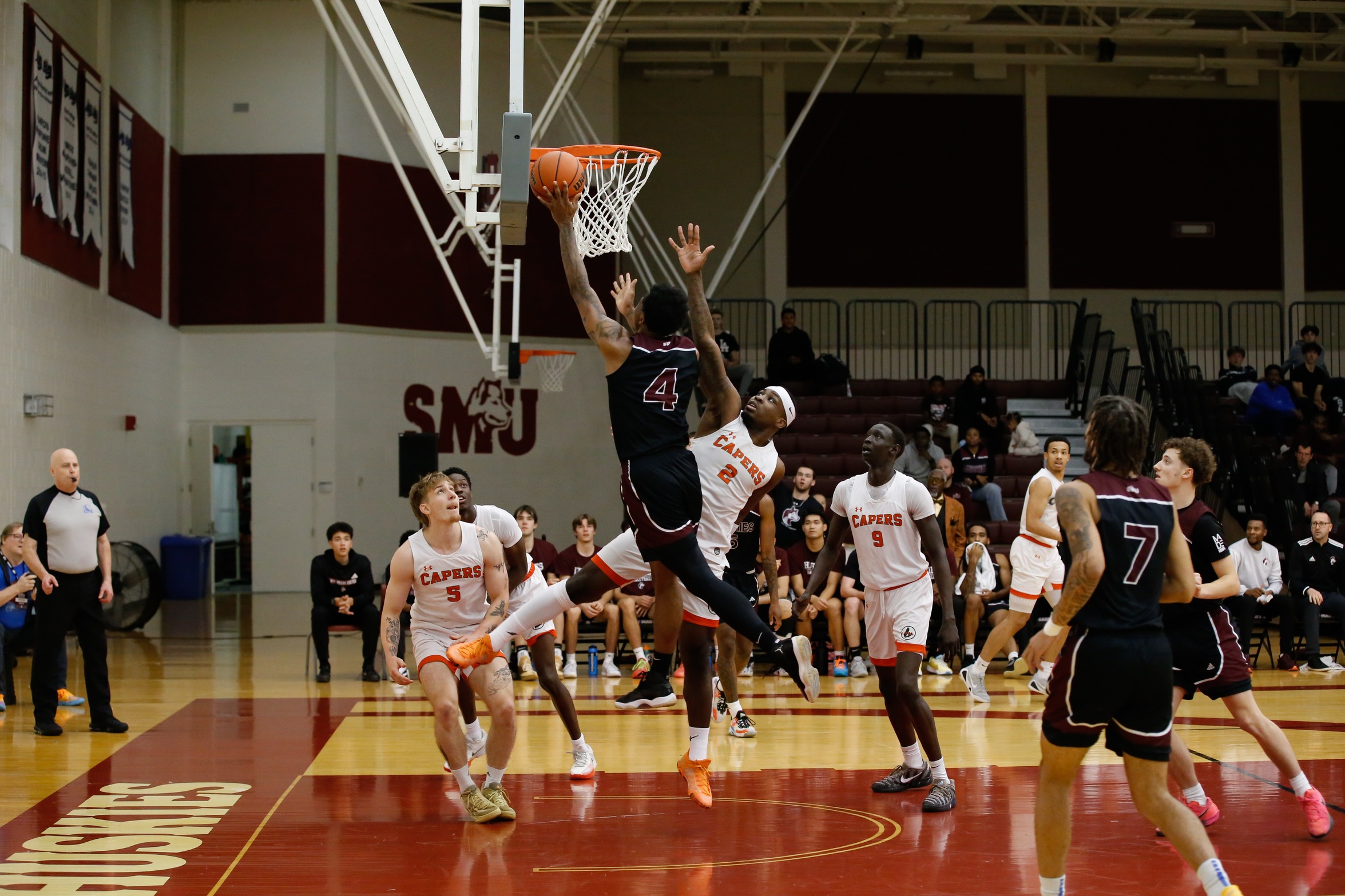 Capers come back to defeat Huskies 79-74